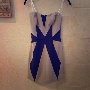 Taupe and black fitted dress.